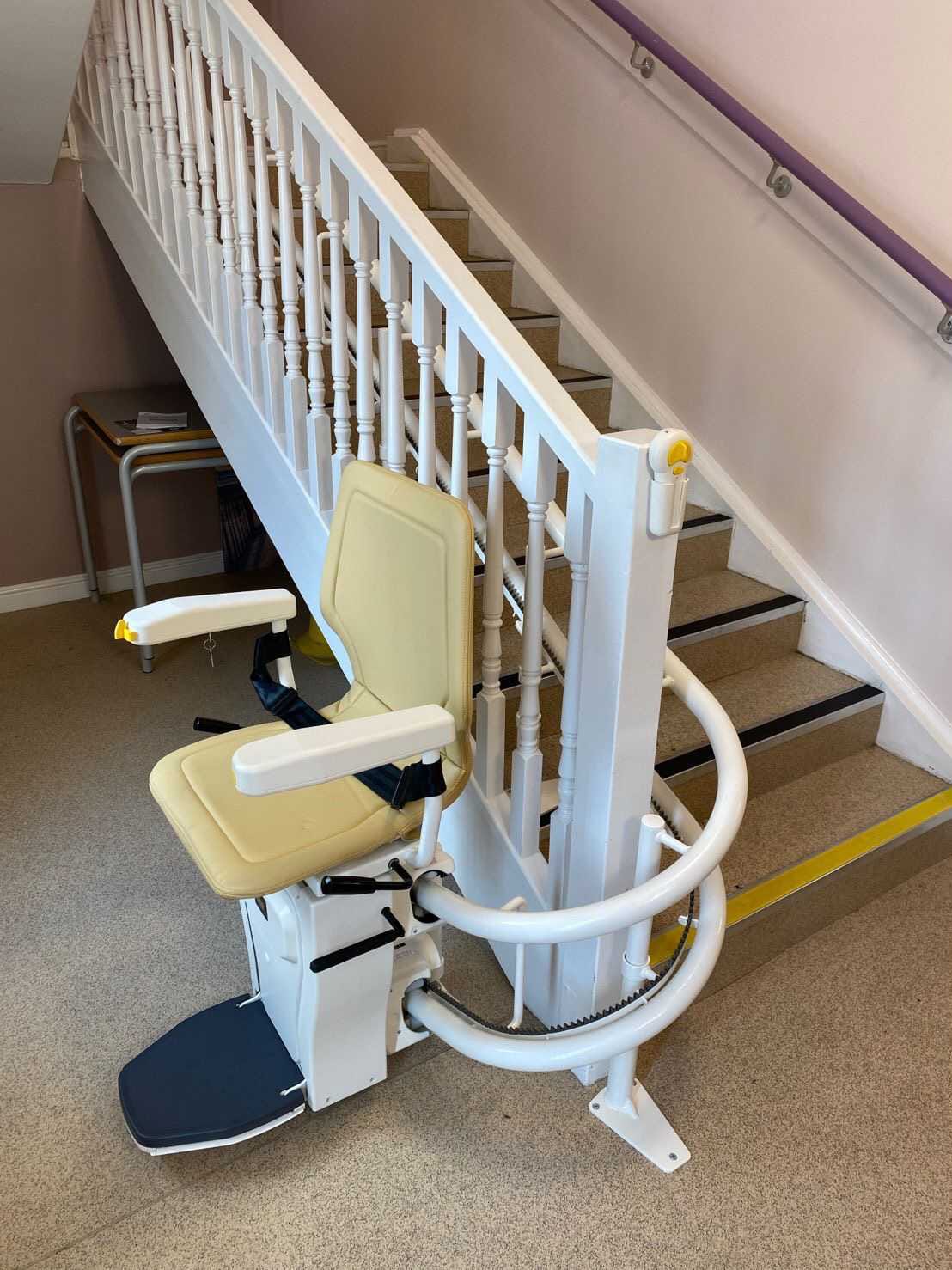 Curved stair lift installed on a custom staircase in a Cleveland Heights Ohio home, designed for safe mobilty between floors