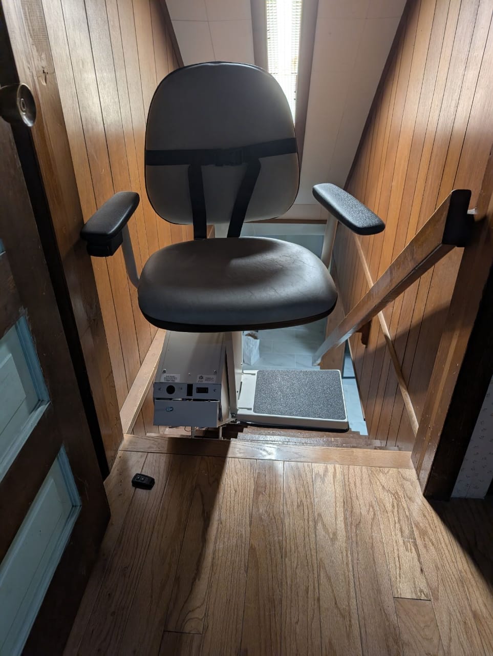 Straight stair lift installed on indoor staircase in Mentor Ohio providing safe and reliable access between floors