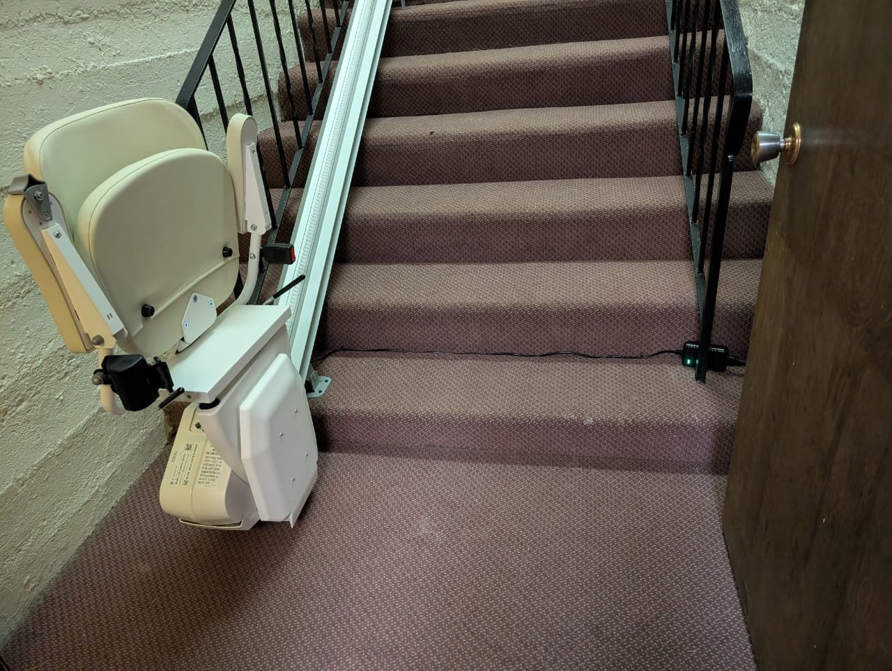 Straight stair lift on residential staircase in Beachwood Ohio improving safe access throughout the home