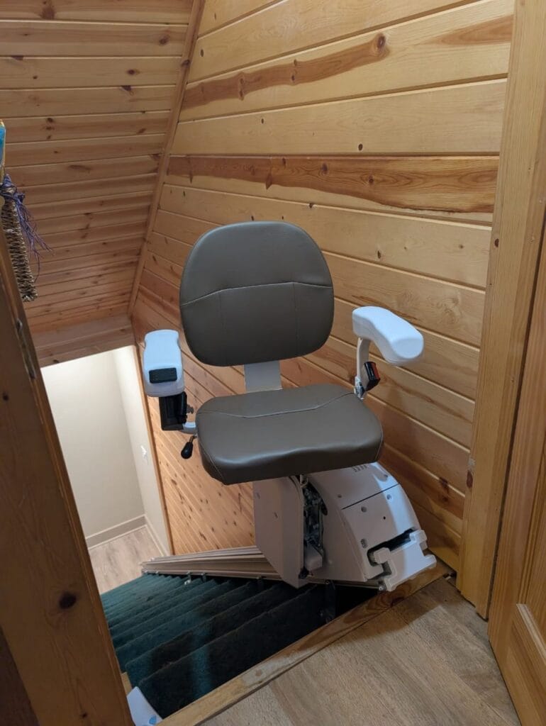 Straight stair lift installed on residential staircase for smooth and reliable movement