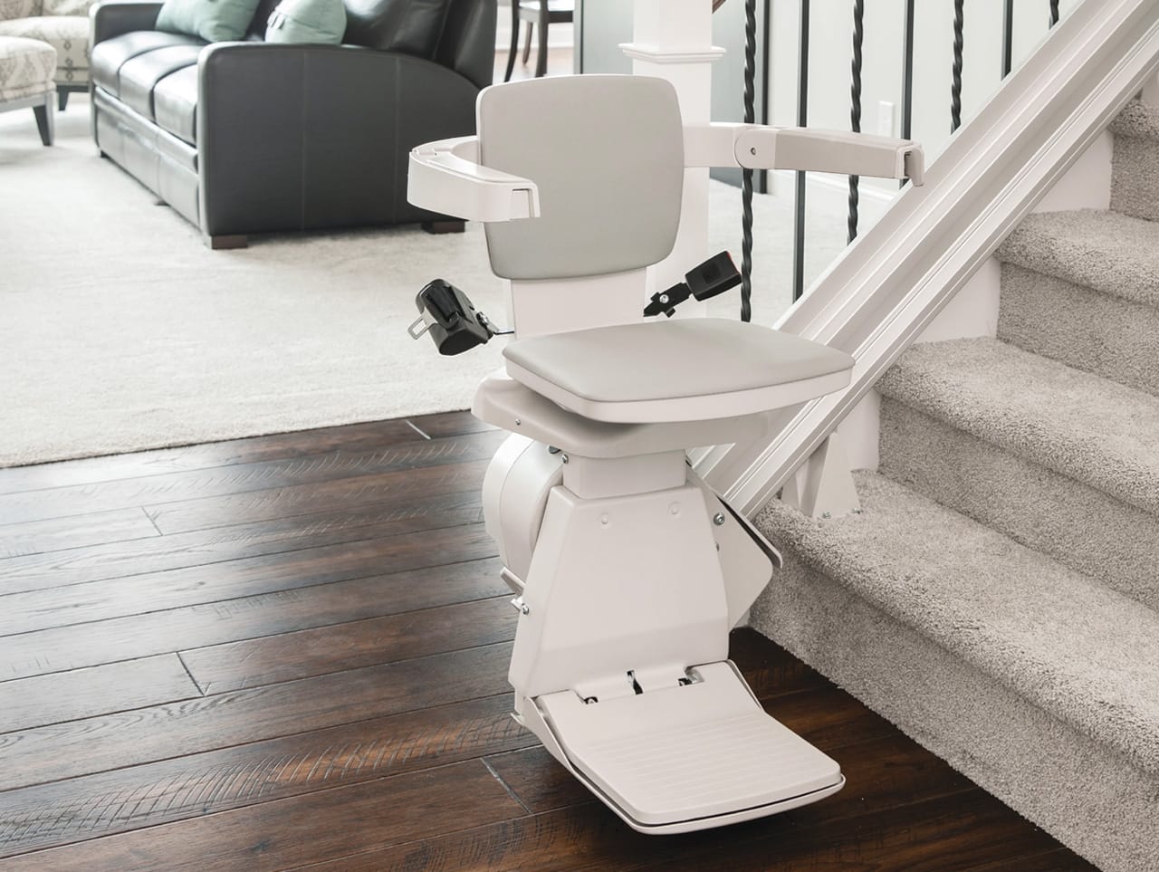 Residential stair lift installed on a staircase