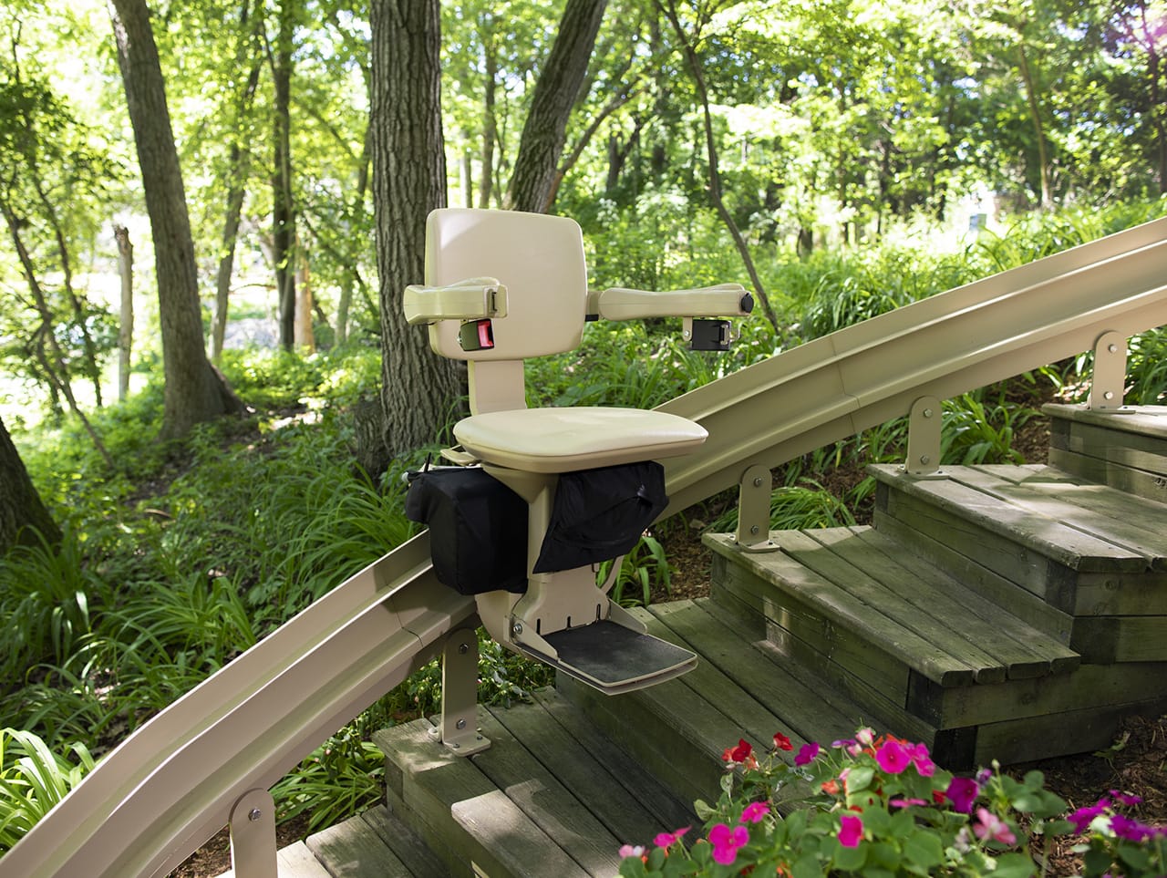 Outdoor stair lift installed on exterior steps during winter